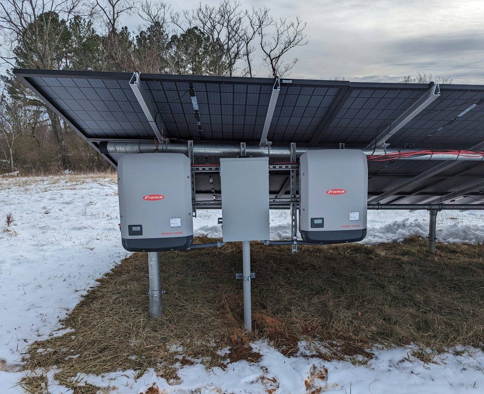 a solar panel attached to a pole in the snow